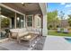 Relaxing patio furniture with a view of the backyard and pool at 11952 Girasole Ave, Las Vegas, NV 89138