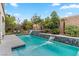 Stunning pool with double waterfalls and spacious deck at 11952 Girasole Ave, Las Vegas, NV 89138