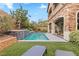 Resort-style pool with lush landscaping and artificial turf at 11952 Girasole Ave, Las Vegas, NV 89138