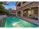 Private backyard with a sparkling pool and adjacent patio perfect for lounging at 11952 Girasole Ave, Las Vegas, NV 89138