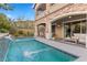 Resort-style backyard with a sparkling pool and expansive patio at 11952 Girasole Ave, Las Vegas, NV 89138