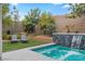 Inviting backyard pool and landscaped yard with lush greenery at 11952 Girasole Ave, Las Vegas, NV 89138