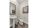 Modern powder room, featuring a pedestal sink and a toilet at 11952 Girasole Ave, Las Vegas, NV 89138