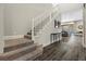 Modern staircase with white railing and carpeted steps leading to the upper level at 11952 Girasole Ave, Las Vegas, NV 89138