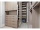 Custom walk-in closet with shelving, drawers, and safe at 11952 Girasole Ave, Las Vegas, NV 89138