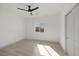 Bright bedroom features neutral walls, modern flooring, a window and a closet at 1308 E Nelson Ave, North Las Vegas, NV 89030