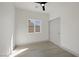 Bedroom with a ceiling fan, a window and a closet, enhancing the room's appeal at 1308 E Nelson Ave, North Las Vegas, NV 89030