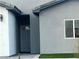 Modern front entrance with gray door and landscaping at 1308 E Nelson Ave, North Las Vegas, NV 89030