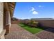 Landscaped backyard with artificial turf and a rock border at 131 Mosso Niente Pl, Henderson, NV 89011