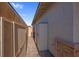 Storage sheds and a paved pathway in a private backyard space at 131 Mosso Niente Pl, Henderson, NV 89011