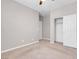 Bedroom with ceiling fan, neutral walls, and a large closet at 131 Mosso Niente Pl, Henderson, NV 89011