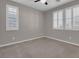 Bedroom with neutral walls, carpeting, and plantation shutters at 131 Mosso Niente Pl, Henderson, NV 89011