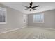 Spacious bedroom with carpet, ceiling fan and large window at 131 Mosso Niente Pl, Henderson, NV 89011