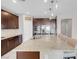 Granite kitchen island with stainless steel appliances at 131 Mosso Niente Pl, Henderson, NV 89011