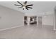 Open living area with kitchen access and ceiling fan at 131 Mosso Niente Pl, Henderson, NV 89011