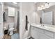 Bathroom with toilet, shower, and vanity with storage at 1690 Normandy Way # 824, Henderson, NV 89014