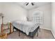 Well-lit bedroom featuring a queen bed, nightstand, and plantation shutters at 1690 Normandy Way # 824, Henderson, NV 89014