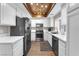 Modern kitchen with white cabinets and wood floor at 1690 Normandy Way # 824, Henderson, NV 89014