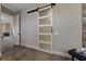 Modern bathroom with barn door and tiled flooring at 2548 Faiss Dr, Las Vegas, NV 89134