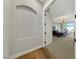 Bright hallway with arched niche and wood-look floors at 2548 Faiss Dr, Las Vegas, NV 89134