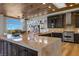 Modern kitchen featuring a large island and wood flooring at 2548 Faiss Dr, Las Vegas, NV 89134