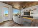 Living room with wood-look floors and a modern media wall at 2548 Faiss Dr, Las Vegas, NV 89134