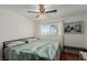 Bedroom with king bed, ceiling fan and large window at 2828 Richfield Blvd, Las Vegas, NV 89102