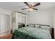 Bedroom with king bed, mirrored closet and ceiling fan at 2828 Richfield Blvd, Las Vegas, NV 89102