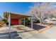 Carport with red door and mature tree landscaping at 2828 Richfield Blvd, Las Vegas, NV 89102