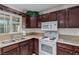 Kitchen featuring dark wood cabinets and a double sink at 2828 Richfield Blvd, Las Vegas, NV 89102