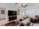 Living room with brown leather sectional sofa and large TV at 2828 Richfield Blvd, Las Vegas, NV 89102