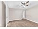 Spacious bedroom with neutral walls, plush carpeting, and a ceiling fan for added comfort at 3108 Emmons St, North Las Vegas, NV 89030