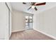 Bedroom with a ceiling fan and a window with outside views, creating a cozy retreat at 3108 Emmons St, North Las Vegas, NV 89030