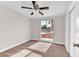 Bright bedroom featuring a ceiling fan and a window with outside views, creating a cozy retreat at 3108 Emmons St, North Las Vegas, NV 89030