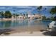 Resort-style lagoon with sandy beach and surrounding palm trees at 3150 Soft Breezes Dr # 2030, Las Vegas, NV 89128