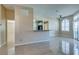 Open living room features a breakfast bar and tile floors at 3150 Soft Breezes Dr # 2030, Las Vegas, NV 89128