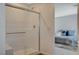 Modern bathroom with walk-in shower and bedroom view at 3354 Via Strada St, Henderson, NV 89044