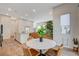 Modern dining area with round marble table and leather chairs at 3354 Via Strada St, Henderson, NV 89044