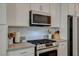 Close-up of kitchen range and microwave at 3354 Via Strada St, Henderson, NV 89044