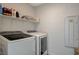 Clean laundry room with washer, dryer, and storage at 3354 Via Strada St, Henderson, NV 89044