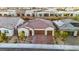 Aerial view of a house with solar panels and a brick driveway at 349 Agnew St, Las Vegas, NV 89138