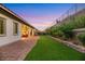 Landscaped backyard with artificial turf and retaining wall at 349 Agnew St, Las Vegas, NV 89138