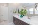 Double vanity bathroom with modern fixtures and large mirror at 349 Agnew St, Las Vegas, NV 89138