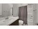 Bathroom with shower/tub combo and dark vanity at 349 Agnew St, Las Vegas, NV 89138