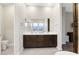 Double vanity bathroom with modern fixtures and large mirror at 349 Agnew St, Las Vegas, NV 89138