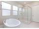 Elegant bathroom with soaking tub and glass shower at 349 Agnew St, Las Vegas, NV 89138