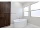 Relaxing bathroom with soaking tub, shower, and modern vanity at 349 Agnew St, Las Vegas, NV 89138