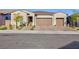 Single-story house with three-car garage and well-manicured landscaping at 349 Agnew St, Las Vegas, NV 89138