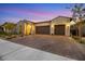 Beautiful single-story home with a three-car garage at dusk at 349 Agnew St, Las Vegas, NV 89138