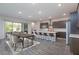 Modern kitchen with island, barstools and large dining table at 349 Agnew St, Las Vegas, NV 89138